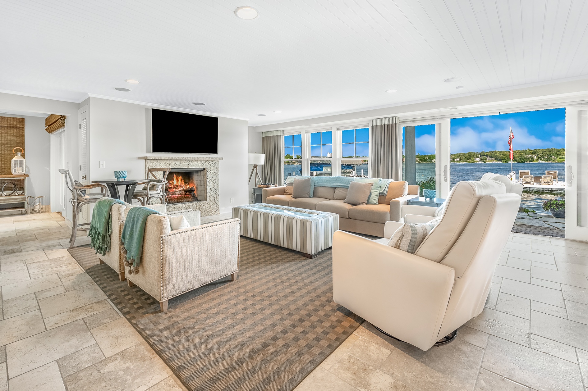 Great room with fireplace and lakefront wall