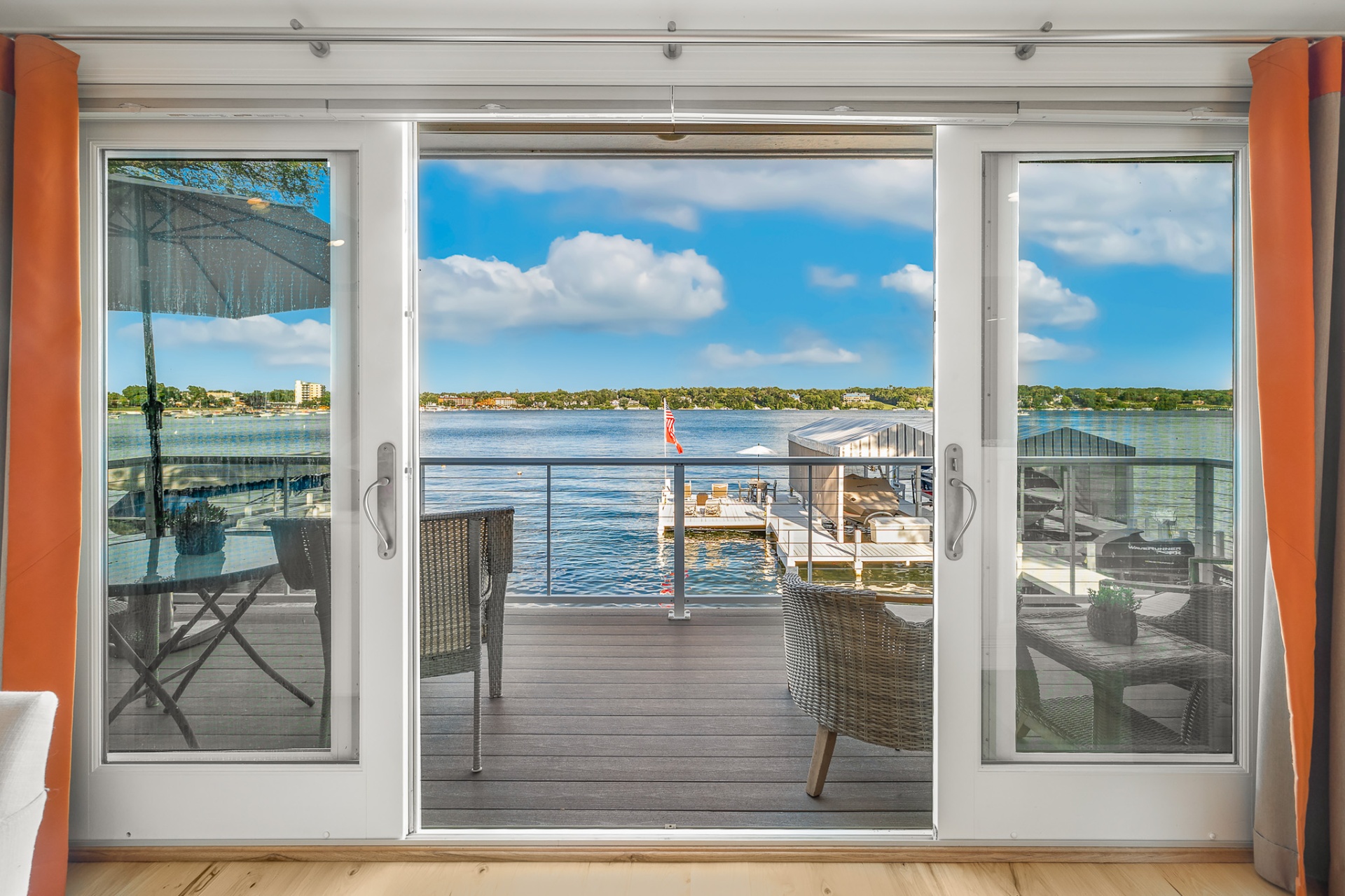 Balcony sliding doors framing the lake